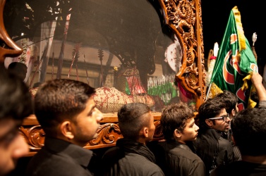During the processions along the road in a district of Mumbay, the faithful carry on their shoulders the coffin with the body of Hussein pierced by arrows that killed him in battle